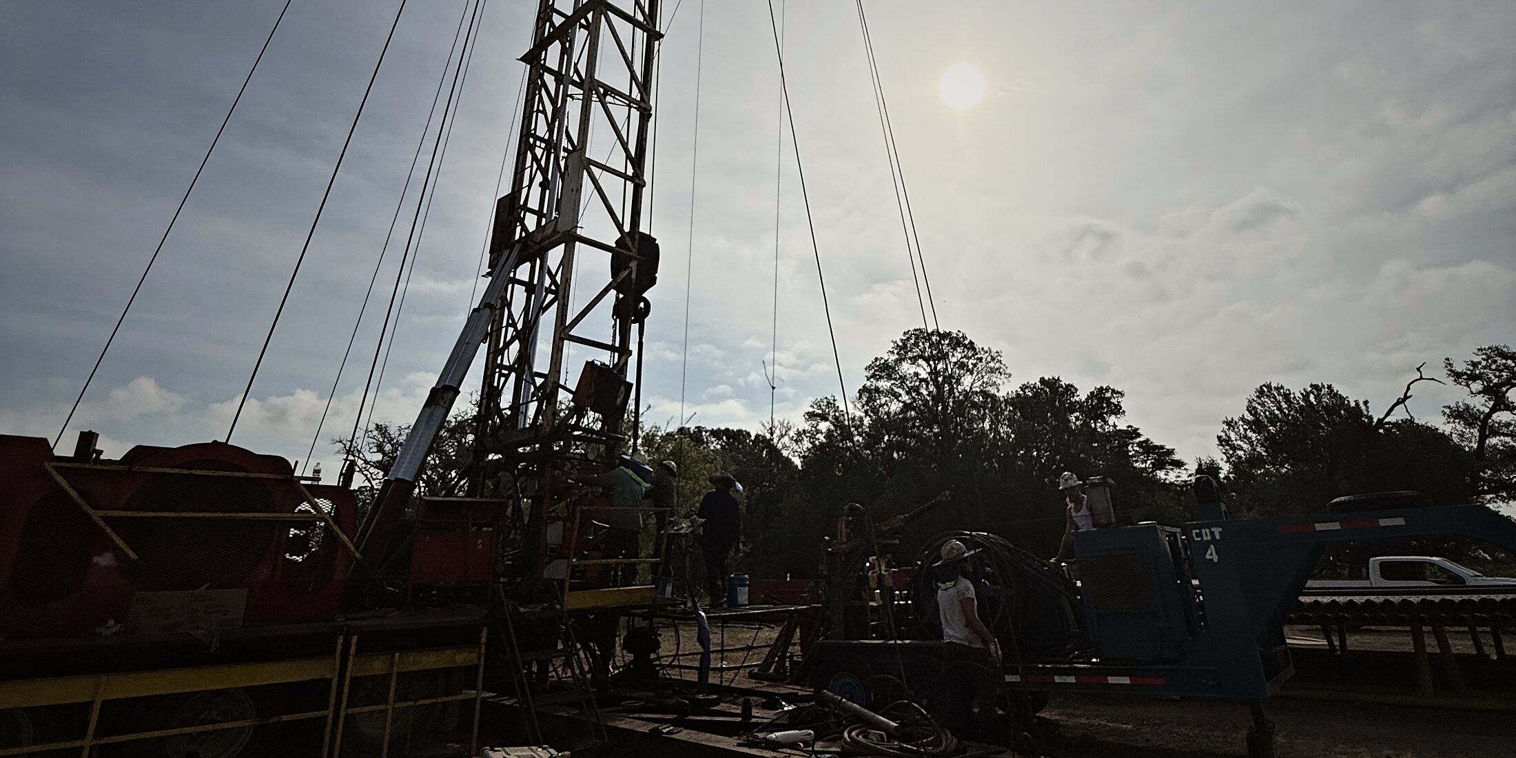 Workover rig silhouetted against the afternoon sun on the Vaughan Well No. 1 location